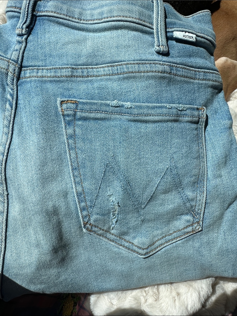 MOTHER High-Rise Light Blue Denim Jeans with Signature Back Pocket